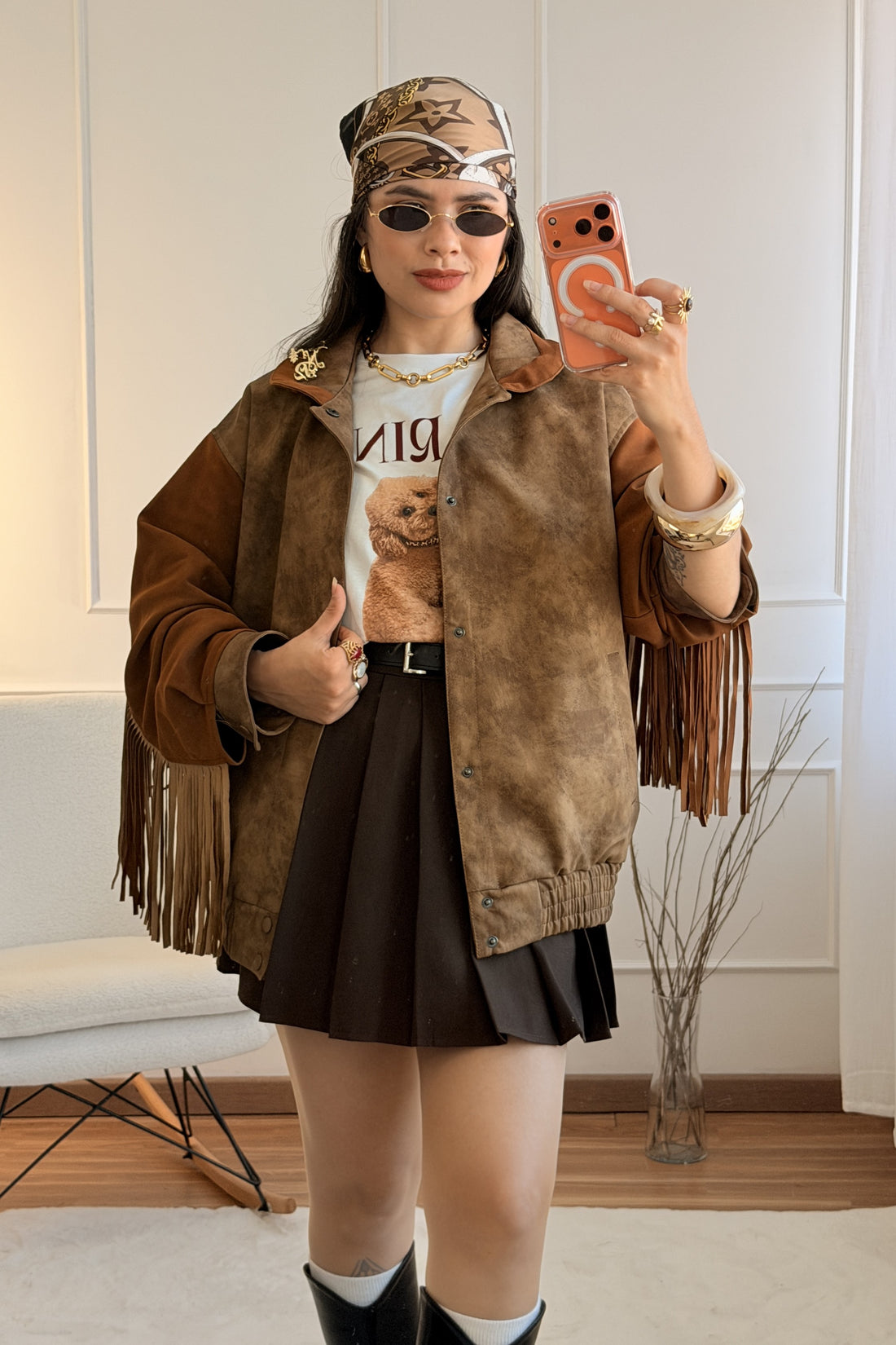 Casaco com franjas e aplicação estampada