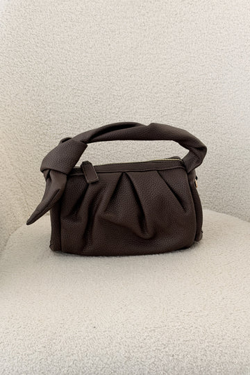 Bolsa de mão com laço