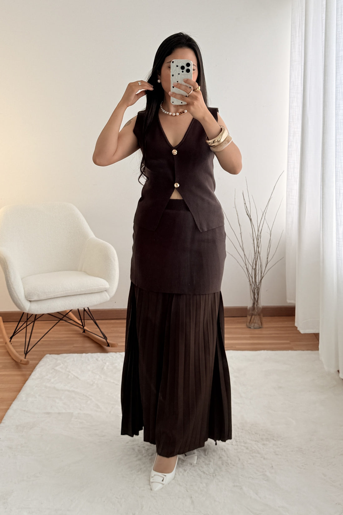 Conjunto malha colete e saia plissada